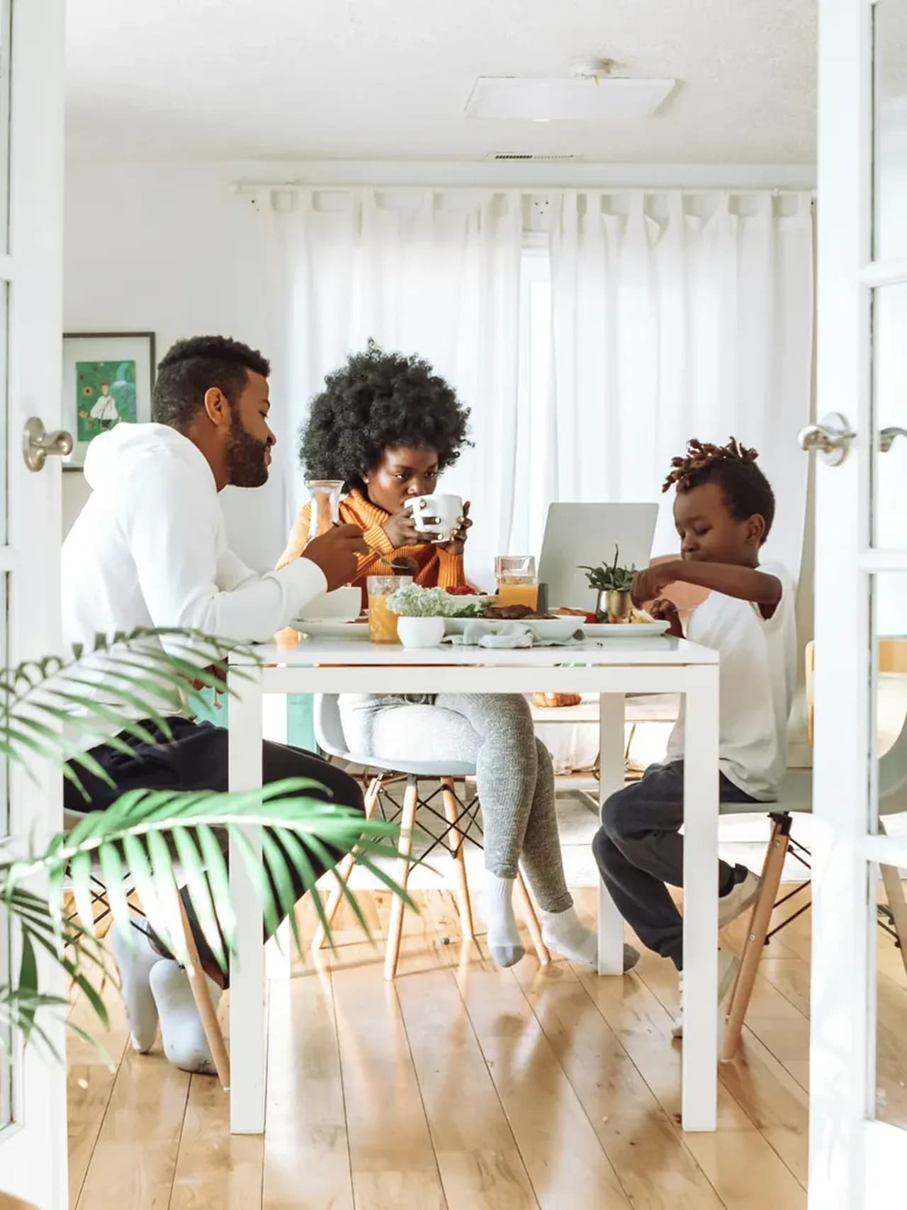 A family enjoying breakfast together at home